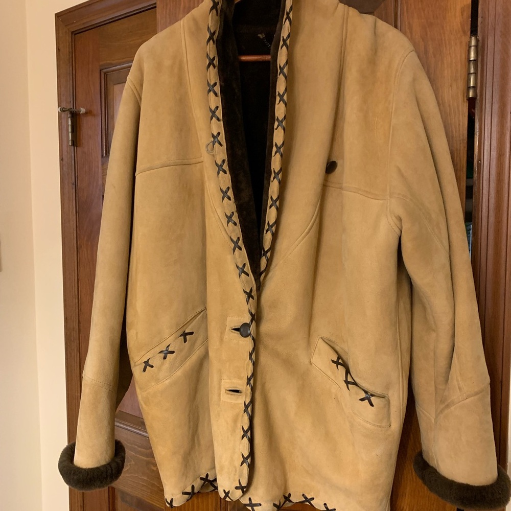 Genuine, fur-lined, shearling, original owner, circa 1999. Excellent condition.